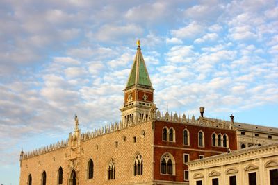 Low angle view of cathedral against cloudy sky