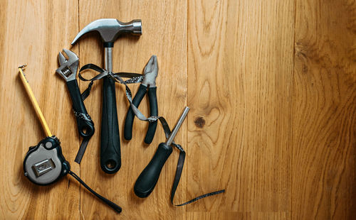 High angle view of equipment on wooden wall