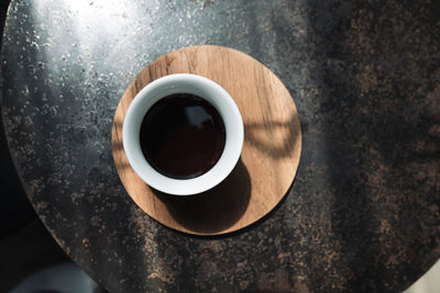 High angle view of coffee cup on table