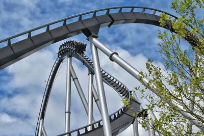 Low angle view of ferris wheel against sky