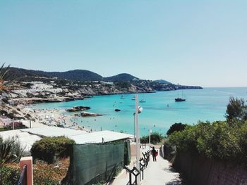 View of calm sea against clear blue sky