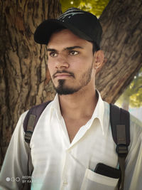 Portrait of young man standing outdoors