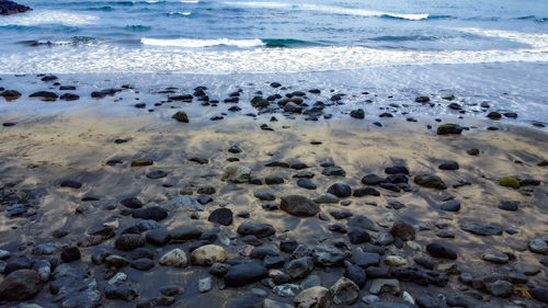 High angle view of pebbles on beach