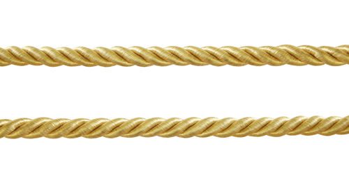 Close-up of rope against white background