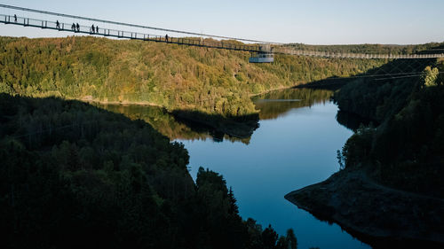 Scenic view of bridge over river against sky