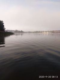 View of lake against cloudy sky