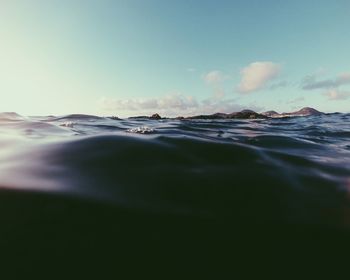 Surface level of sea against sky