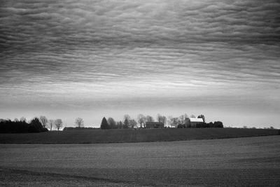 Scenic view of landscape against cloudy sky