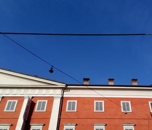 Low angle view of building against clear blue sky