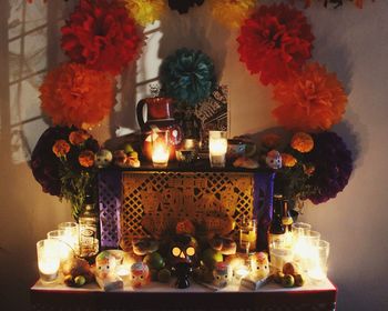 Close-up of illuminated candles on table