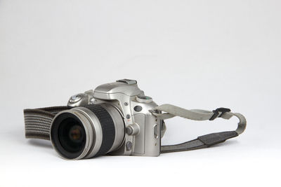 Close-up of camera over white background