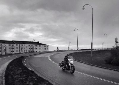 View of road against cloudy sky