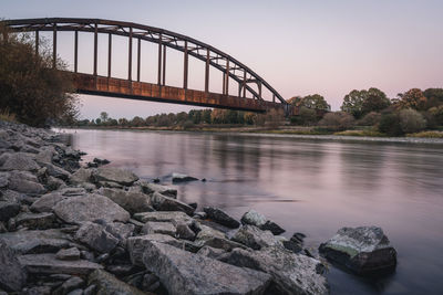 Bridge over river against sky