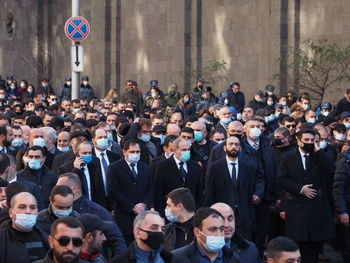 Group of people standing in front of city