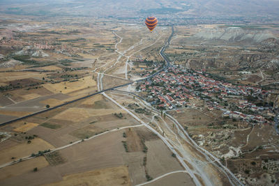 Aerial view of hot air balloon over city