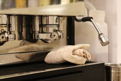 Close-up of faucet in kitchen at home