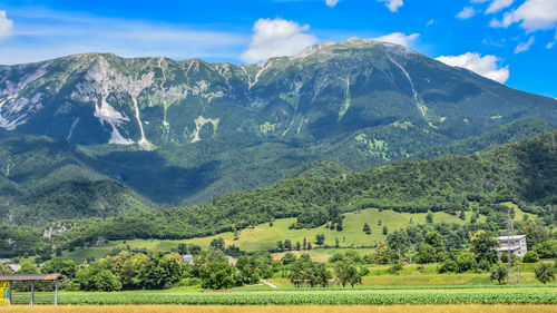 Scenic view of landscape and mountains against sky