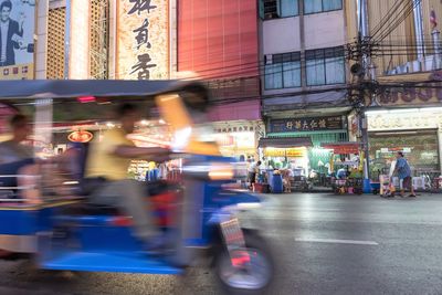 Blurred motion of people on city street