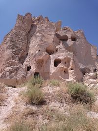 Scenic view of rocky mountains against blue sky