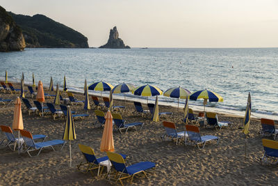 Umbrellas and closed parasols at beach