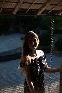 Portrait of woman standing outdoors