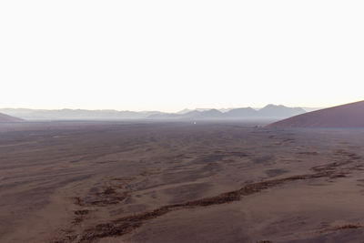 Scenic view of desert against clear sky