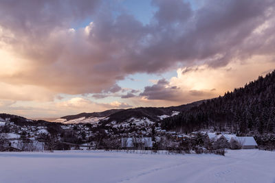 Scenic view of mountains against sky during winter