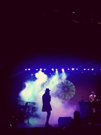 Silhouette people at music concert