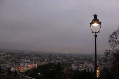 View of illuminated city at dusk