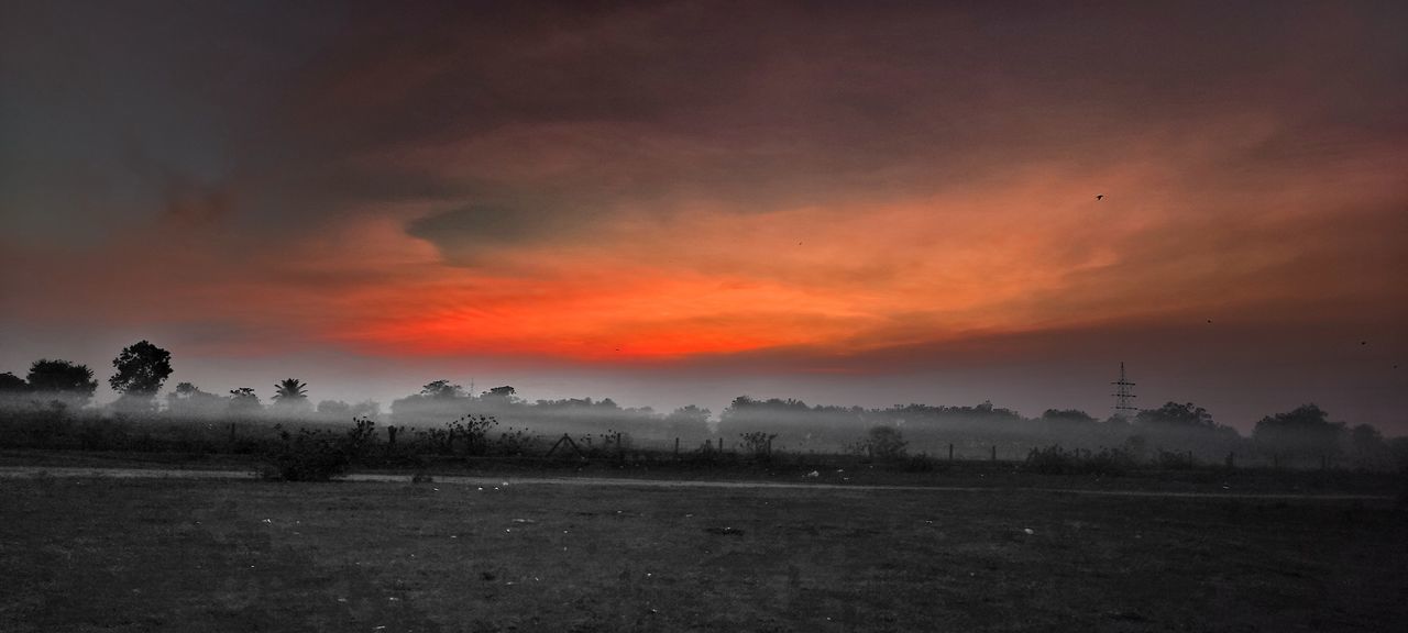 sky, environment, landscape, cloud, sunset, horizon, dawn, beauty in nature, nature, scenics - nature, fog, land, tranquility, tree, plant, no people, evening, field, tranquil scene, rural scene, silhouette, outdoors, dramatic sky, sun, orange color, twilight, afterglow, atmospheric mood, non-urban scene, idyllic, darkness, agriculture, architecture