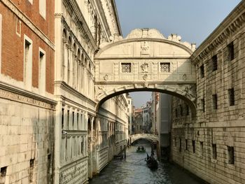 Bridge if sighs arch bridge over canal amidst buildings in venice