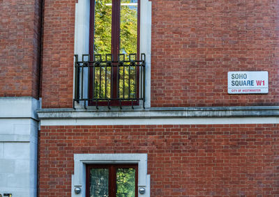 Close-up of text on brick wall