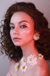 Side view portrait of teenage girl wearing flowers