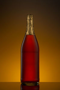 Close-up of glass bottle on table