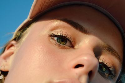 Close-up portrait of woman in sunny day