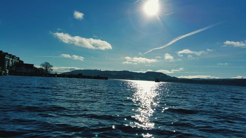 Scenic view of sea against cloudy sky