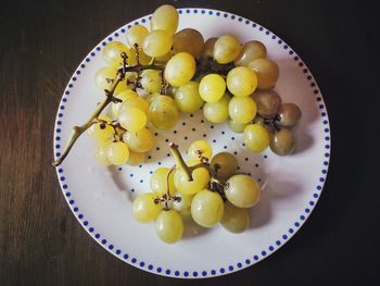 High angle view of fruits in plate on table