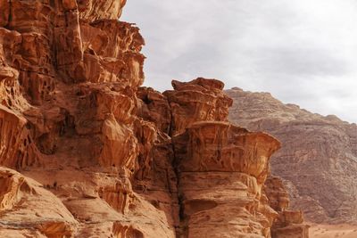 Low angle view of rock formation against sky