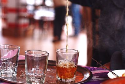 Close-up of tea being poured on table