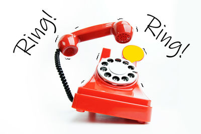 Close-up of telephone booth against white background