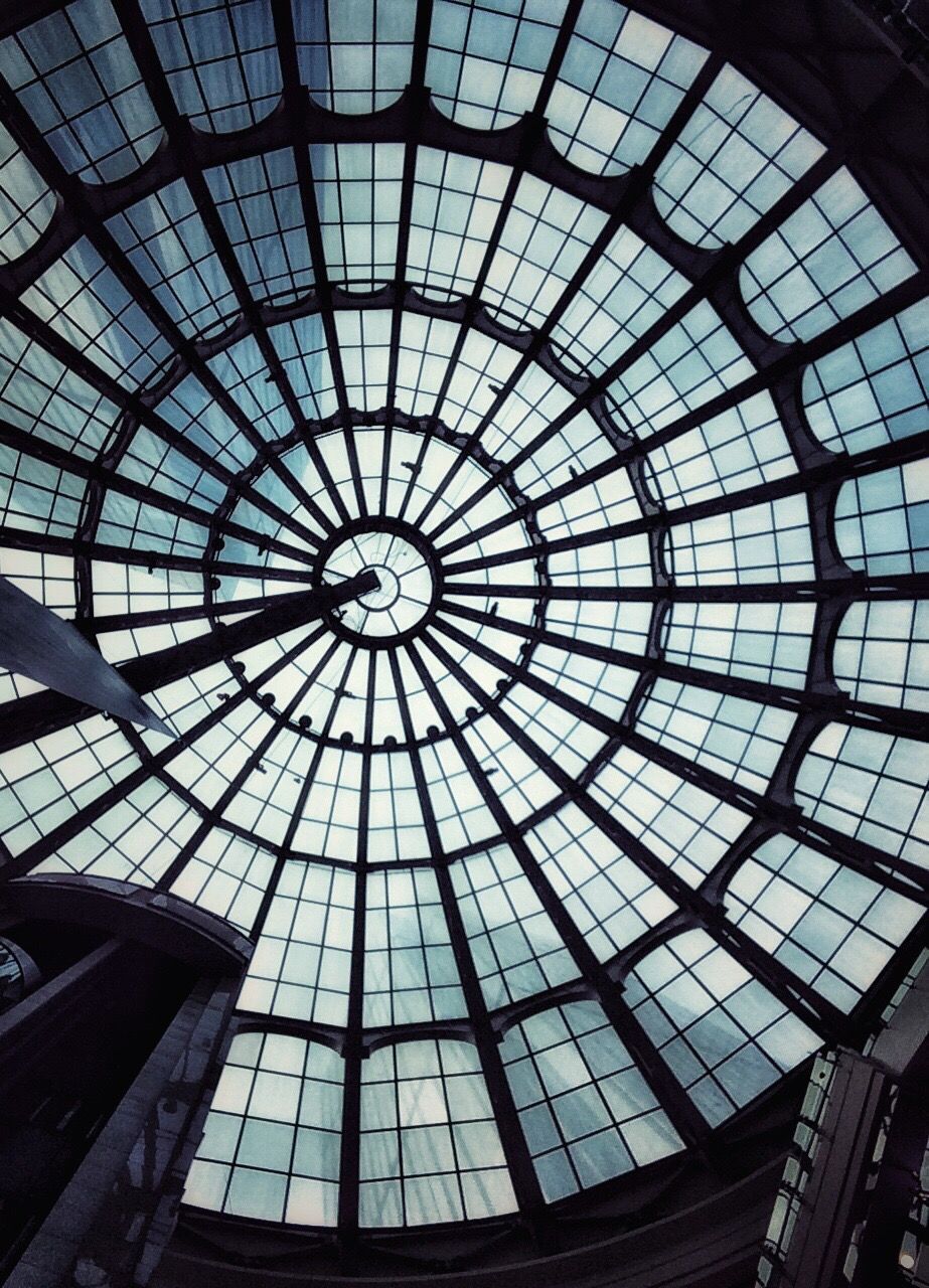 indoors, ceiling, architecture, built structure, low angle view, skylight, pattern, architectural feature, glass - material, design, directly below, geometric shape, full frame, backgrounds, interior, window, circle, no people, modern, transparent