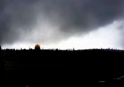 Scenic view of landscape against cloudy sky