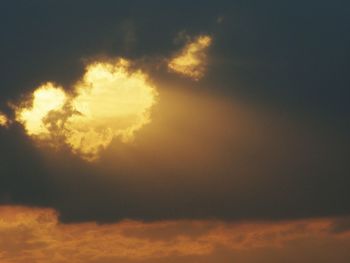 Low angle view of cloudy sky at sunset