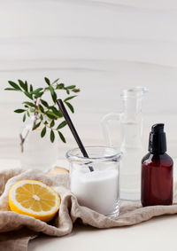 Fruits in glass jar on table