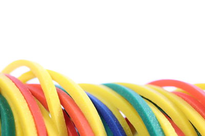 Close-up of multi colored candies against white background