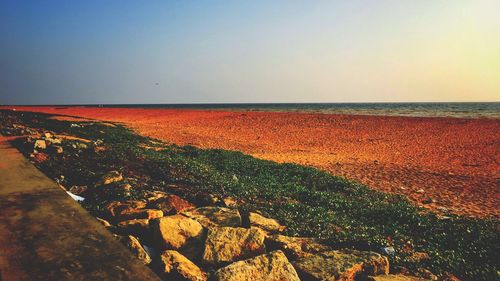 Scenic view of sea against clear sky during sunset