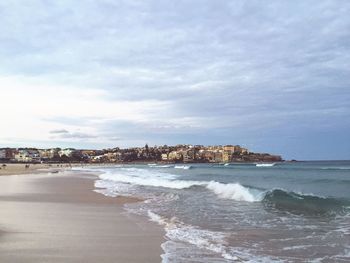 Scenic view of sea against cloudy sky