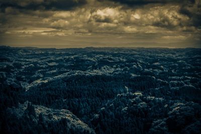 Scenic view of landscape against cloudy sky