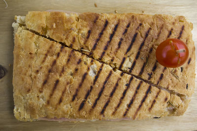 Ham and cheese toast from above on a wooden board