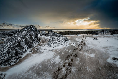 Scenic view of snow covered landscape against sky